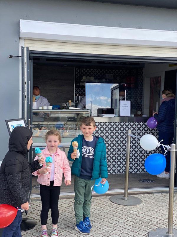 stellisbay_first_customers_portrait children getting ice cream st ellis bay llanelli